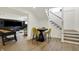 Open basement area featuring a game table, modern stairs, and comfortable seating at 5130 Melbourne Pl, Zionsville, IN 46077