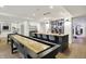 Finished basement boasts a wet bar, shuffleboard table, and ample space for entertaining guests at 5130 Melbourne Pl, Zionsville, IN 46077