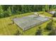 Aerial view of an outdoor basketball and volleyball court inside a fenced perimeter at 5130 Melbourne Pl, Zionsville, IN 46077