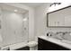 Modern bathroom with walk-in shower, subway tile, and marble countertop at 5130 Melbourne Pl, Zionsville, IN 46077