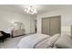 Bedroom featuring a comfortable bed, stylish dresser, and soft, neutral tones at 5130 Melbourne Pl, Zionsville, IN 46077