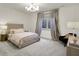 Cozy bedroom featuring soft lighting, a comfortable bed, and elegant curtains at 5130 Melbourne Pl, Zionsville, IN 46077