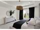 Bright bedroom with a tray ceiling, modern dresser and view of exterior landscape at 5130 Melbourne Pl, Zionsville, IN 46077