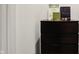 Bedroom detail showcasing dark wood dresser with decorative accents at 5130 Melbourne Pl, Zionsville, IN 46077
