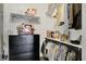 This walk-in closet has shelving and clothing racks for storage at 5130 Melbourne Pl, Zionsville, IN 46077