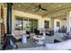 Spacious covered patio with outdoor seating, fireplace, and string lights at 5130 Melbourne Pl, Zionsville, IN 46077