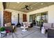 Relaxing covered patio with ample seating and an inviting outdoor fireplace at 5130 Melbourne Pl, Zionsville, IN 46077