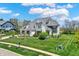 Stunning two-story home boasts a well-manicured lawn, beautiful landscaping, and a charming architectural design at 5130 Melbourne Pl, Zionsville, IN 46077