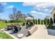Backyard fire pit area with Adirondack chairs, perfect for outdoor gatherings and relaxation at 5130 Melbourne Pl, Zionsville, IN 46077