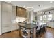 Well-equipped kitchen offers stainless appliances, a large island, and a beautiful wooden range hood at 5130 Melbourne Pl, Zionsville, IN 46077