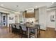 Modern kitchen features pendant lighting, a large center island with seating, and stainless steel appliances at 5130 Melbourne Pl, Zionsville, IN 46077