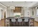 Bright kitchen showcasing a large island, pendant lighting, and white cabinetry, perfect for cooking and entertaining at 5130 Melbourne Pl, Zionsville, IN 46077