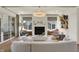 A bright and airy living room features a modern fireplace, large windows, and stylish decor at 5130 Melbourne Pl, Zionsville, IN 46077