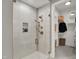 Modern shower featuring tile walls, glass door, and built in shelves for toiletries at 5130 Melbourne Pl, Zionsville, IN 46077