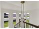 Spacious foyer with a modern chandelier and staircase offering great natural light from many windows at 5130 Melbourne Pl, Zionsville, IN 46077