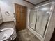 Bathroom featuring a vanity, sink, shower stall with glass doors, and modern fixtures at 529 E Jackson St, Martinsville, IN 46151