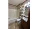 Full bathroom featuring a shower-tub combo, toilet, and a vanity with storage space at 529 E Jackson St, Martinsville, IN 46151