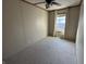 Standard bedroom with neutral walls and carpet and a window with curtains at 529 E Jackson St, Martinsville, IN 46151