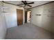 Bedroom featuring neutral walls and carpet, with a closet and access to another room at 529 E Jackson St, Martinsville, IN 46151
