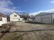 Property featuring house with garage and large metal garage building on gravel drive at 529 E Jackson St, Martinsville, IN 46151