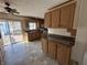 Spacious kitchen boasts a sliding glass door to the deck, wood cabinets, and efficient layout at 529 E Jackson St, Martinsville, IN 46151