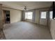 Inviting living room with carpet, a ceiling fan, and a large window filling the room with natural light at 529 E Jackson St, Martinsville, IN 46151