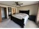 Spacious main bedroom with a large bed, mirror, and access to an en-suite bathroom at 529 E Jackson St, Martinsville, IN 46151