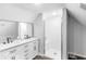 Modern bathroom featuring a double sink vanity, a shower with a glass door, and sleek design at 555 N Hamilton Ave, Indianapolis, IN 46201