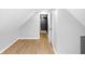Bedroom featuring hardwood floors, gray walls, and a door leading to the hallway at 555 N Hamilton Ave, Indianapolis, IN 46201