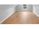 Bright bedroom featuring hardwood floors, gray walls, and a window for natural light at 555 N Hamilton Ave, Indianapolis, IN 46201