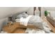 Cozy bedroom featuring a comfortable bed, warm lighting, and neutral tones at 555 N Hamilton Ave, Indianapolis, IN 46201