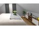 Cozy bedroom design with bed, shelving, decorations, and natural light from the window at 555 N Hamilton Ave, Indianapolis, IN 46201