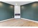 Modern living room features a sleek marble fireplace and stylish hardwood floors at 555 N Hamilton Ave, Indianapolis, IN 46201