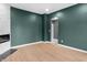 Spacious living room features a modern fireplace, stylish hardwood floors, and contemporary design at 555 N Hamilton Ave, Indianapolis, IN 46201