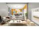 Sunlit living room flows into the kitchen, showcasing a stylish, open-concept layout at 555 N Hamilton Ave, Indianapolis, IN 46201