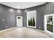 Bright living room features a neutral palette and large windows for natural light at 555 N Hamilton Ave, Indianapolis, IN 46201