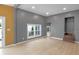 Open living room features neutral colors, natural light, and hardwood flooring at 555 N Hamilton Ave, Indianapolis, IN 46201