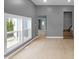 This living room has hardwood floors, bright windows, and gray walls at 555 N Hamilton Ave, Indianapolis, IN 46201