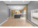 This open floor plan features a modern kitchen and hardwood floors at 555 N Hamilton Ave, Indianapolis, IN 46201