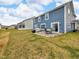 House exterior showing large backyard with patio dining space at 5788 Terracotta Trce, McCordsville, IN 46055
