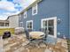 Patio of home with blue siding, featuring an outdoor dining area at 5788 Terracotta Trce, McCordsville, IN 46055