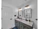 Elegant bathroom featuring double vanity, modern lighting and neutral color palette at 5788 Terracotta Trce, McCordsville, IN 46055