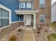 Inviting front entrance with a white door, stylish decor, and manicured landscaping at 5788 Terracotta Trce, McCordsville, IN 46055