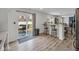 Open concept kitchen with a breakfast bar and sliding door access to the backyard patio at 5788 Terracotta Trce, McCordsville, IN 46055