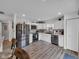 Well-equipped kitchen featuring stainless steel appliances and sleek, white cabinetry at 5788 Terracotta Trce, McCordsville, IN 46055