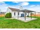 Lawn view of a home featuring a concrete patio under a pergola, a storage shed, and a fenced yard at 6036 Terrytown Pkwy, Indianapolis, IN 46254