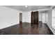 Large bedroom featuring hardwood floors and a modern barn door at 6036 Terrytown Pkwy, Indianapolis, IN 46254