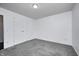 Bedroom featuring neutral walls, gray carpeting, and a closet for storage at 6036 Terrytown Pkwy, Indianapolis, IN 46254
