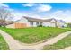 Street view of a single-Gathering home with a well-manicured front lawn and fenced yard at 6036 Terrytown Pkwy, Indianapolis, IN 46254