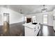 Modern kitchen with a central island, stainless appliances, and open to the living area at 6036 Terrytown Pkwy, Indianapolis, IN 46254